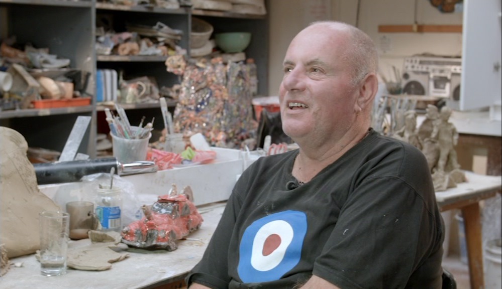 Ceramic artist Robert Rapson in his studio surrounded by his hand-made ceramics